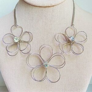 Charming Charlie silvertone wire necklace three flowers with rhinestone centers